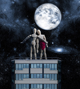 建筑顶端的木头人物拥抱着夜空看图片