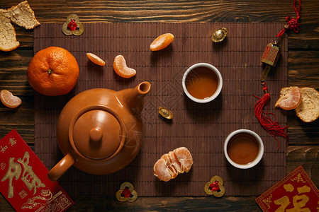 茶叶拍摄茶叶橘子和竹垫上传统装饰背景
