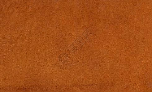 带纹理的浅棕色和橙色皮革背景图片