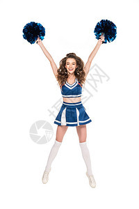 穿着制服的快乐啦队女孩跳着蓝色的波蓬舞图片