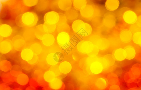 抽象的模糊背景圣诞树上黄色和红色闪红亮的草图片