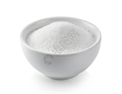 白色背景上的白碗里的白糖背景图片