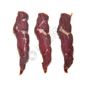 三个南非干肉片牛肉在白色背景下被隔离图片