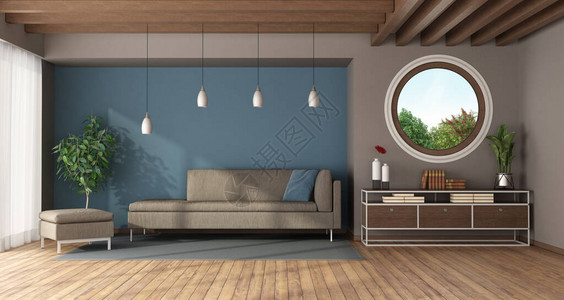 带圆窗沙发脚凳和餐具柜的蓝色现代客厅图片