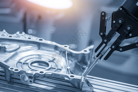 机器人手臂在汽车零部件生产线中用于质量控制过程的操作机械臂的高科技汽车零背景图片