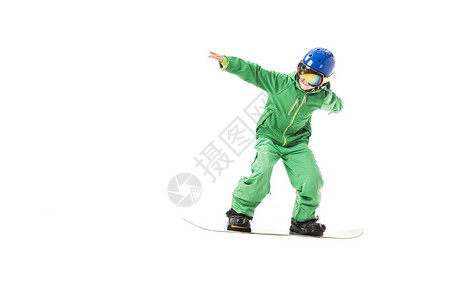 身穿绿色滑雪服护目镜和蓝头盔滑雪衣的图片