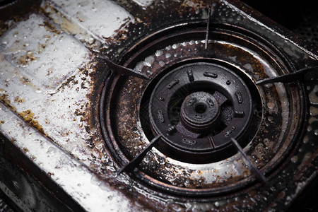 肮脏的炉灶用油脂黑烧的煤油涂污老图片