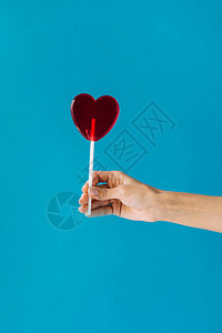女手握心脏成形棒糖图片
