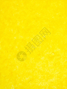 斑驳的黄色壁纸背景的特写图像图片