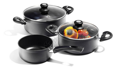 黑色铝炖锅和炊具隔离图片