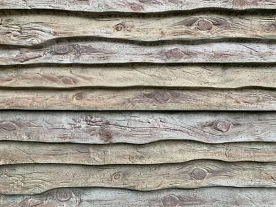 木板形混凝土栅栏模仿混凝土栅栏上的木板条一个原始的现代围栏背景纹理图片