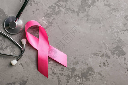 听诊器和具体背景上的粉红丝带乳腺癌宣传月概图片