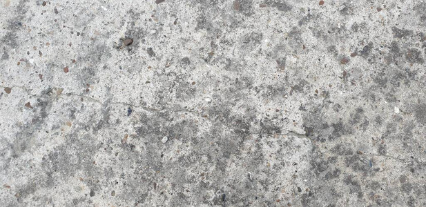 石材表面灰色凹凸不平和苔藓背景图片