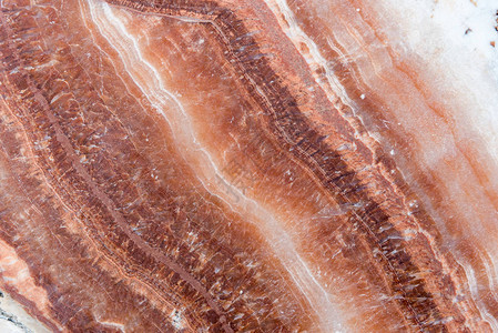 石块白线和红线彩色条纹波形大理石岩石结构坚固耐久等抽象背景的岩图片