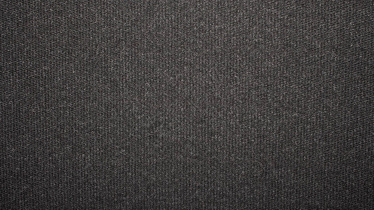 纹理黑色紧密编织地毯地毯的深色背景图片