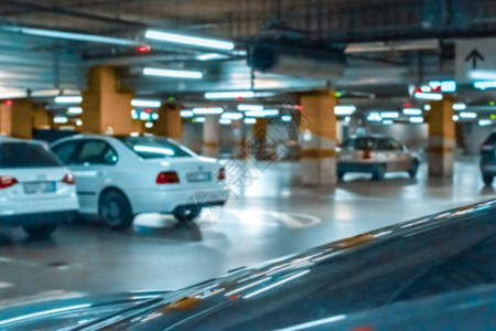 车库模糊地下城车库的停车场停车位在软焦点的空路沥青背景停车场图片