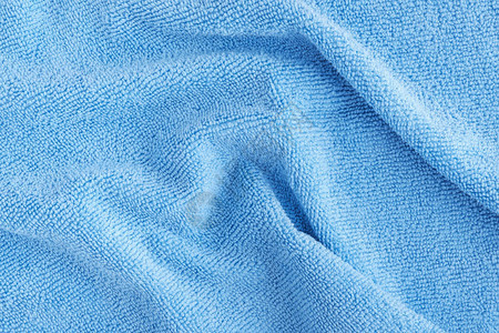 超细纤维毛巾特写的皱纹蓝色超细纤维布质地图片