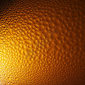 橙色啤酒背景的水滴子美丽的梯度背景图片