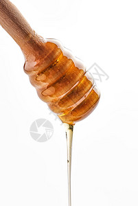蜜糖从蜂蜜棒里流出背景图片