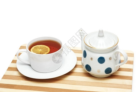 茶杯加柠檬和茶壶图片