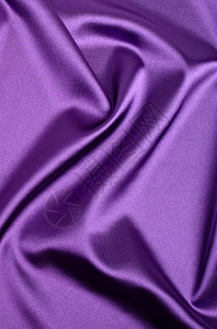 紫色丝绸质感布背景特写图片