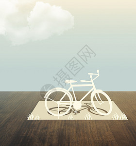 木桌上的自行车剪纸图片