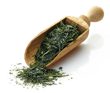 茶叶拍摄含绿色茶叶的木制勺子YameG背景