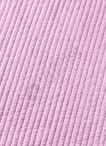 女婴的粉色棉被纹理背景图片
