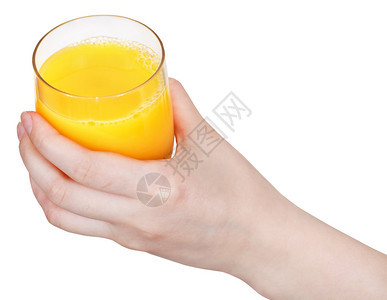 手边有橙子汁的玻璃杯在白色背图片