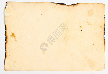 旧纸有肮脏的污渍烧焦的边缘在白图片