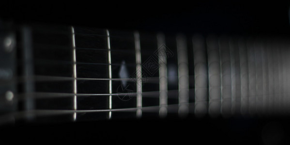 吉他弦的概念低调镜头背景图片