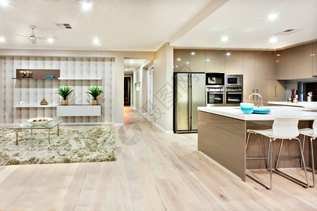 图像的视图描述了厨房和客厅在豪华住宅中的样子背景图片