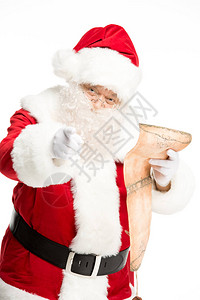圣诞老人在白色上被孤立的阅读希望列表背景图片