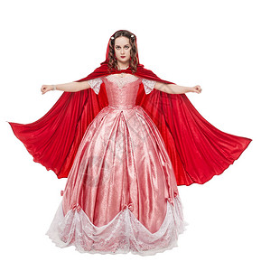 服装展览穿着长中世纪长裙和白衣的红斗背景