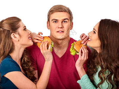 团体汉堡快餐与火腿在人们手中快餐概念男人和女人在吃派对女孩鬼混图片