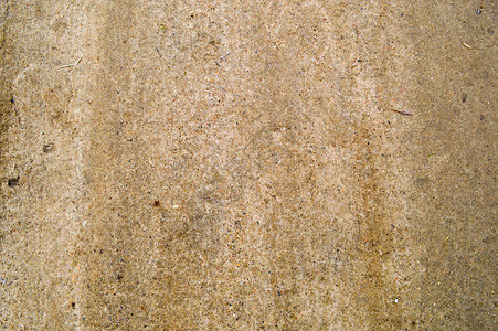 泥土路背景上密实的棕色沙子鹅卵石的泥土质地图片