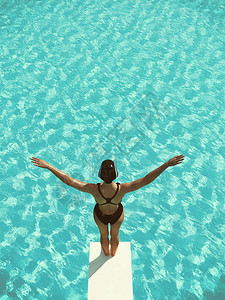 年轻女子从蹦床上跳入水中这是3D的插图片