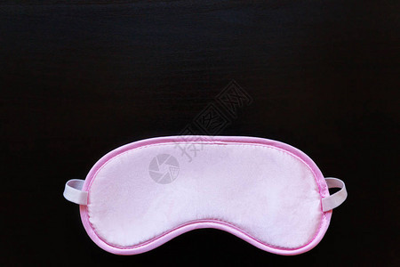 粉红色的睡眠眼罩背景图片