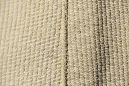 编织机器编织毛线的棕色背景近图片
