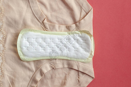 用于在家中格子布上保护女卫生的月经卫生巾背景图片