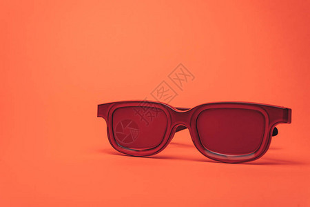 红眼镜印在珊瑚橙色背景背景图片