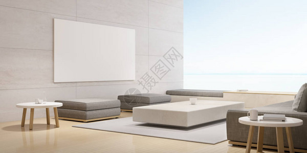现代豪华客厅与白色沙发和画布相框在轮廓墙上内地设计与大窗的海景背背景图片
