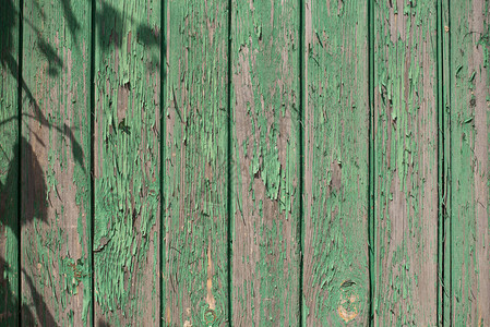 旧木板背景的旧木板在旧板上涂有磨擦淡色海绿油漆背景图片