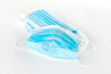 蓝色防护简单外科口罩展开许多简单的抗一次口罩组堆物体分离产品拍摄医疗安全用品大宗采背景图片