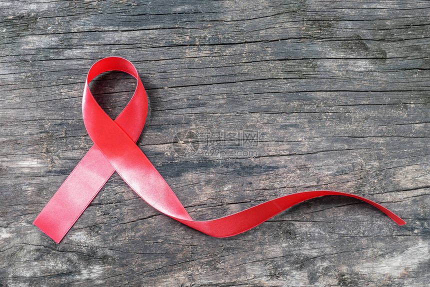 世界艾滋病日活动的红丝带意识支持艾滋传播疾病图片