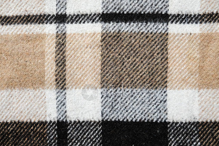 棕色格子毛毯全尺寸背景纹理的特写视图纺织一块布隔离在家学习或工作时背景图片