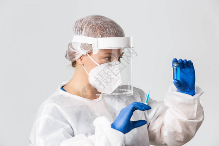 实验室技术女医生或科学家在个人防护设备中的简介图片