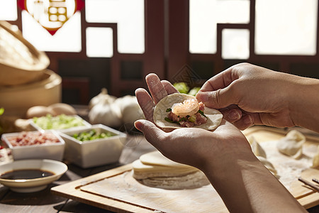 玉米饺子包饺子手部特写背景