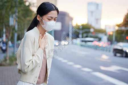 雾霾咽喉不舒服的女性背景