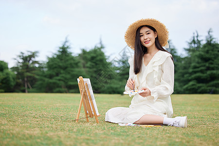 文艺青年美女户外油画写生背景图片